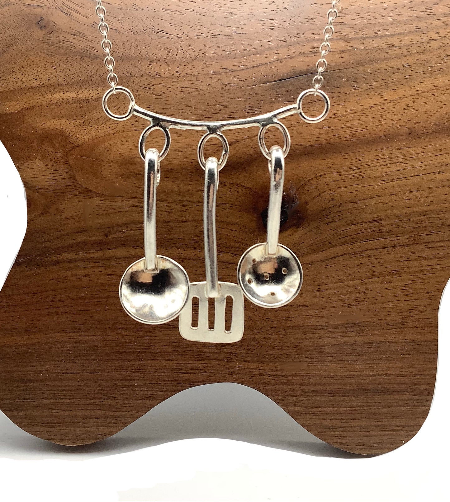 Sterling silver cooking utensils necklace.