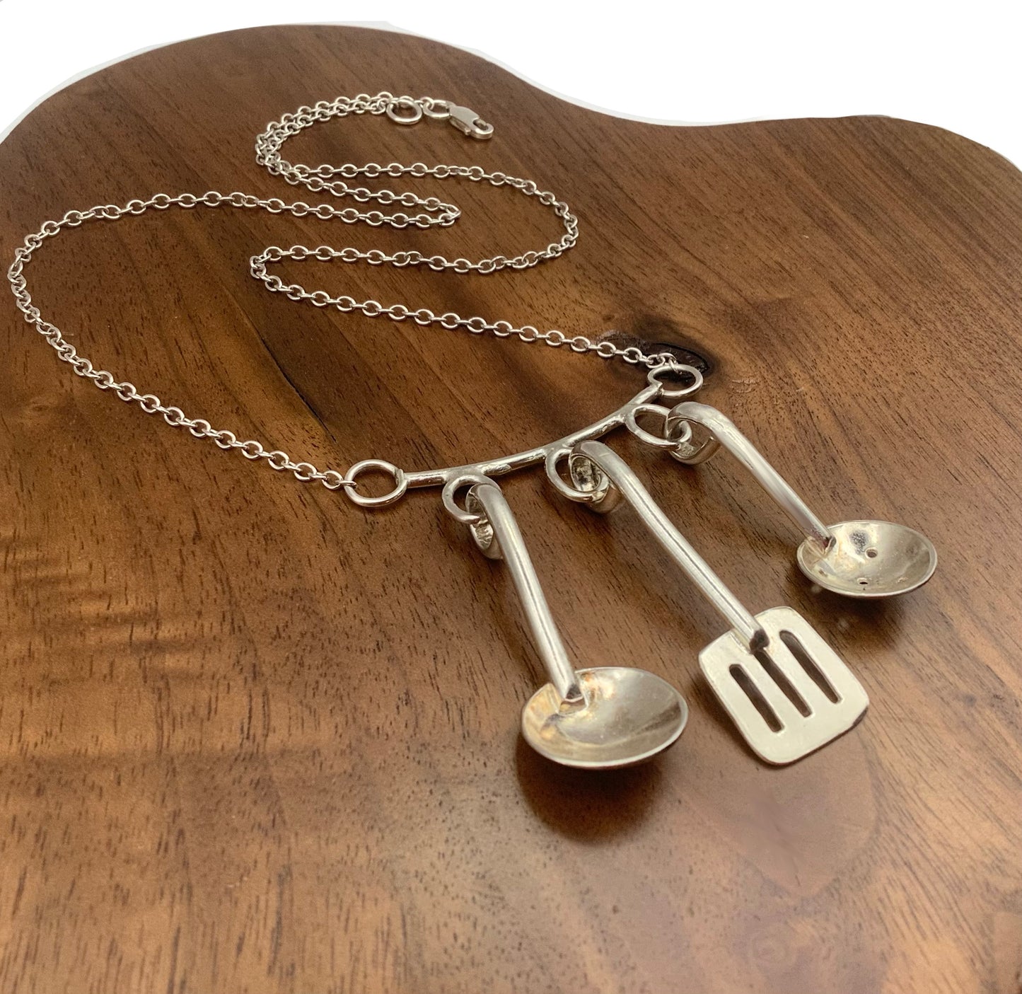 Sterling silver cooking utensils necklace.