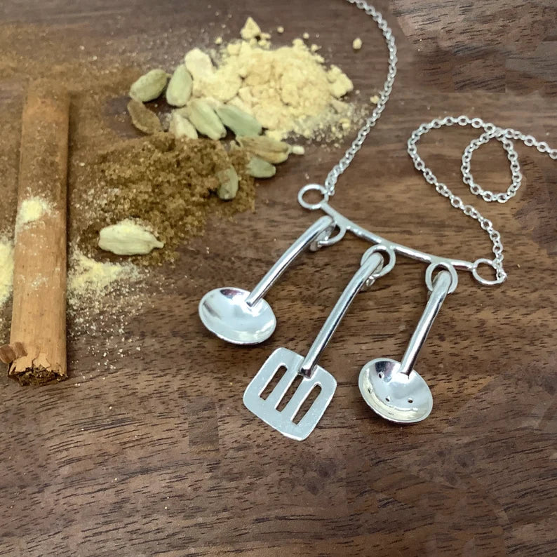 Sterling silver cooking utensils necklace.