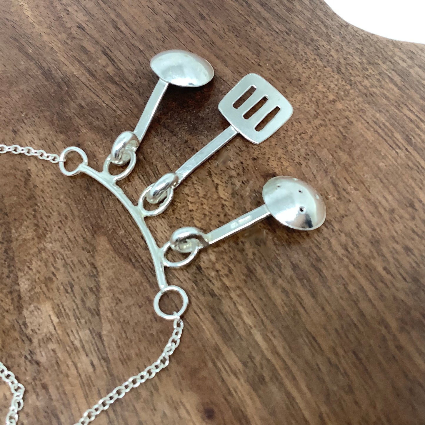 Sterling silver cooking utensils necklace.