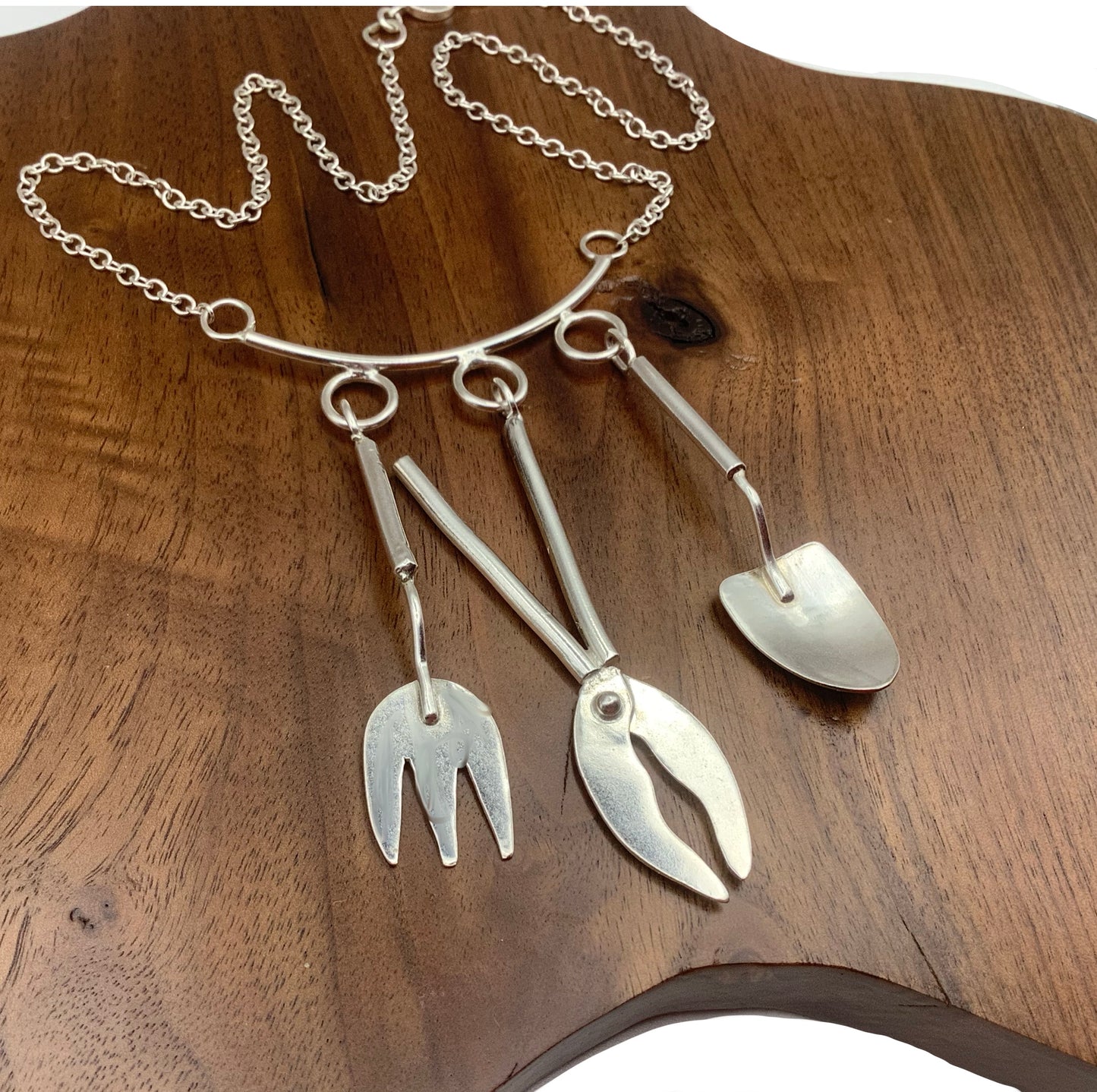 Sterling silver gardening tools necklace