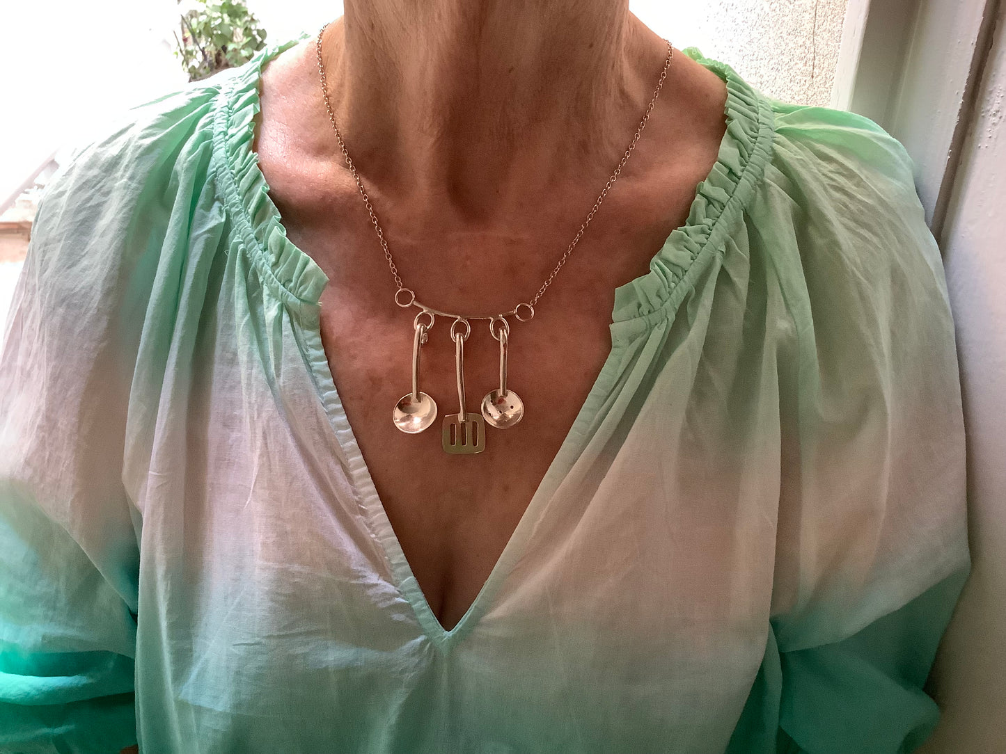 Sterling silver cooking utensils necklace.