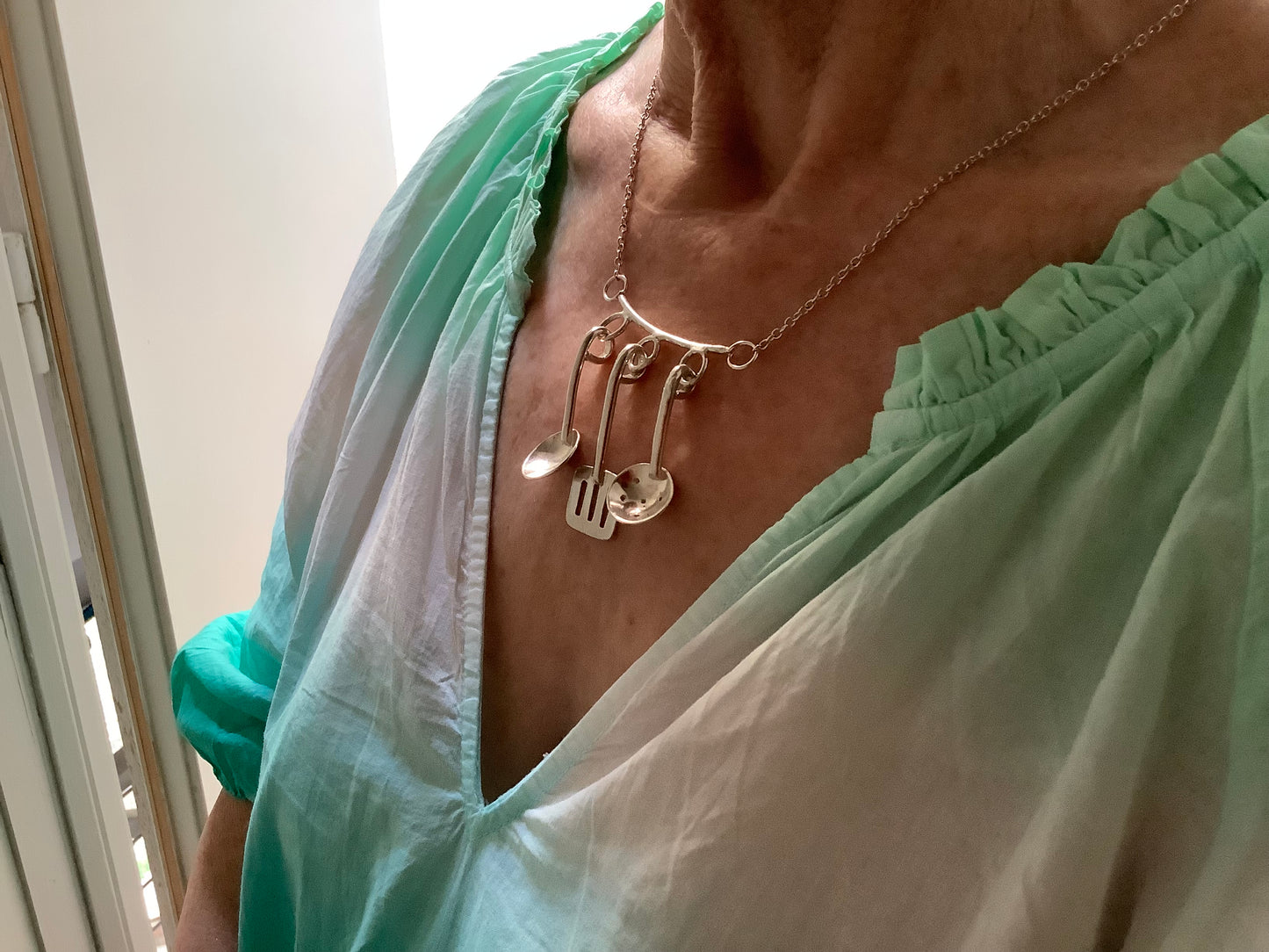 Sterling silver cooking utensils necklace.