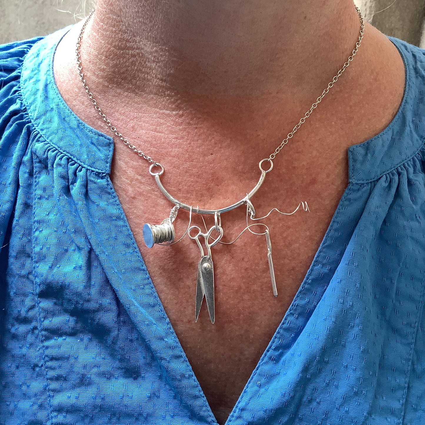 Sterling silver sewing necklace with scissors, needle and thread