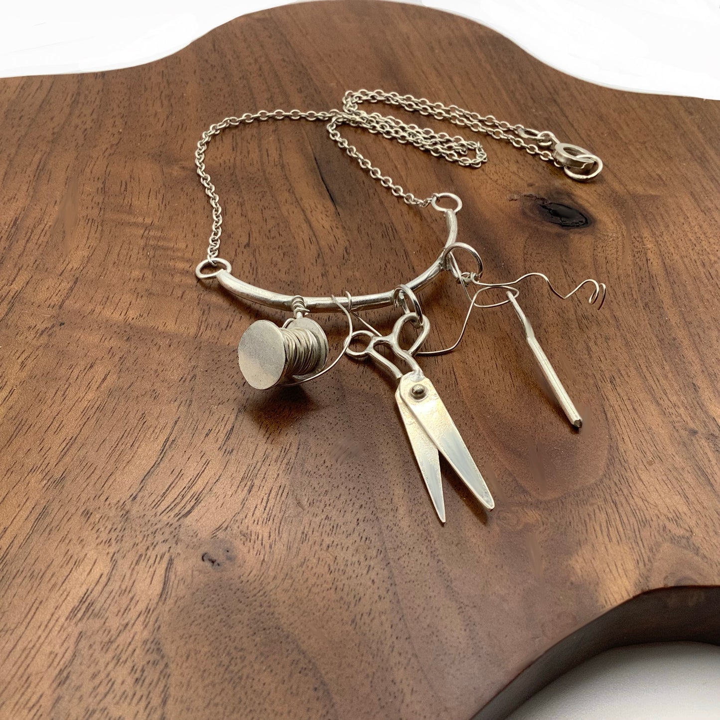 Sterling silver sewing necklace with scissors, needle and thread