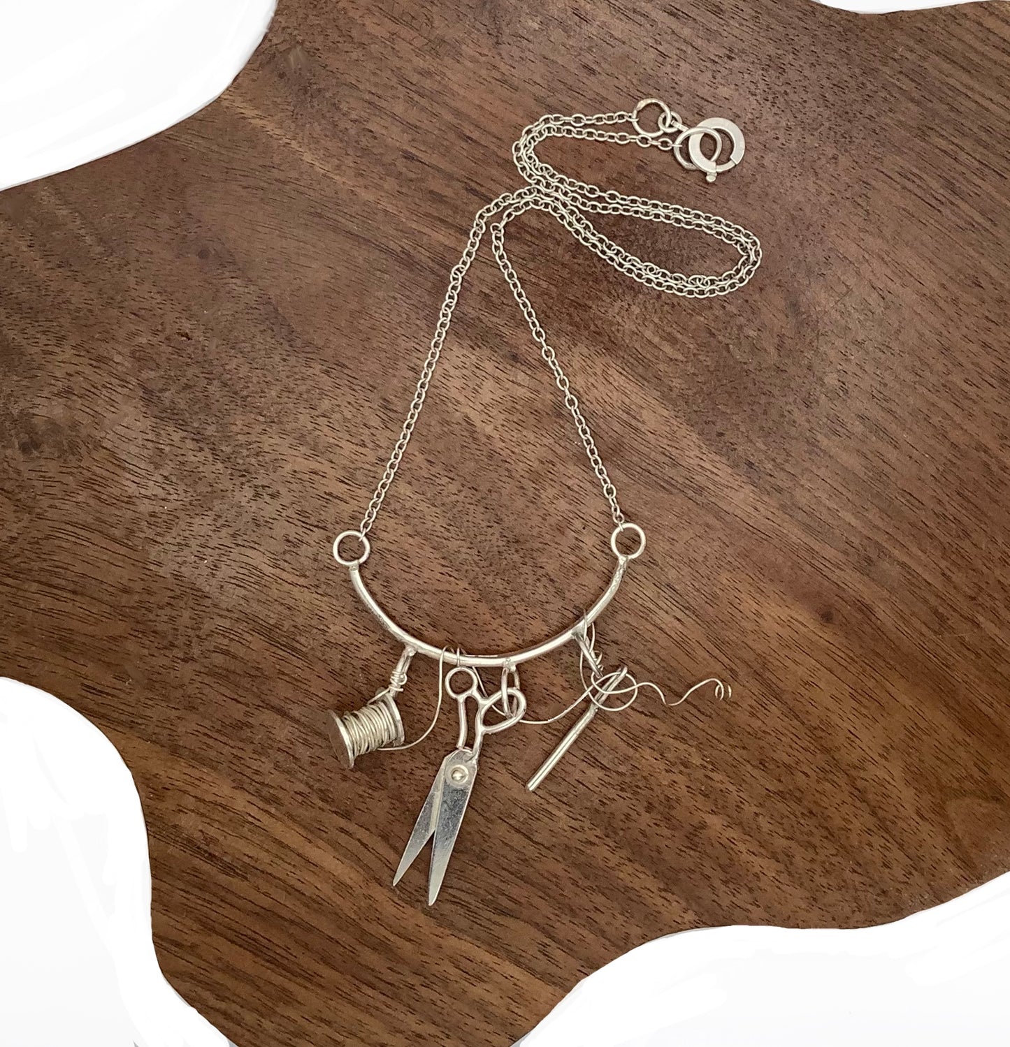Sterling silver sewing necklace with scissors, needle and thread