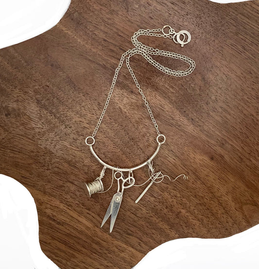 Sterling silver sewing necklace with scissors, needle and thread
