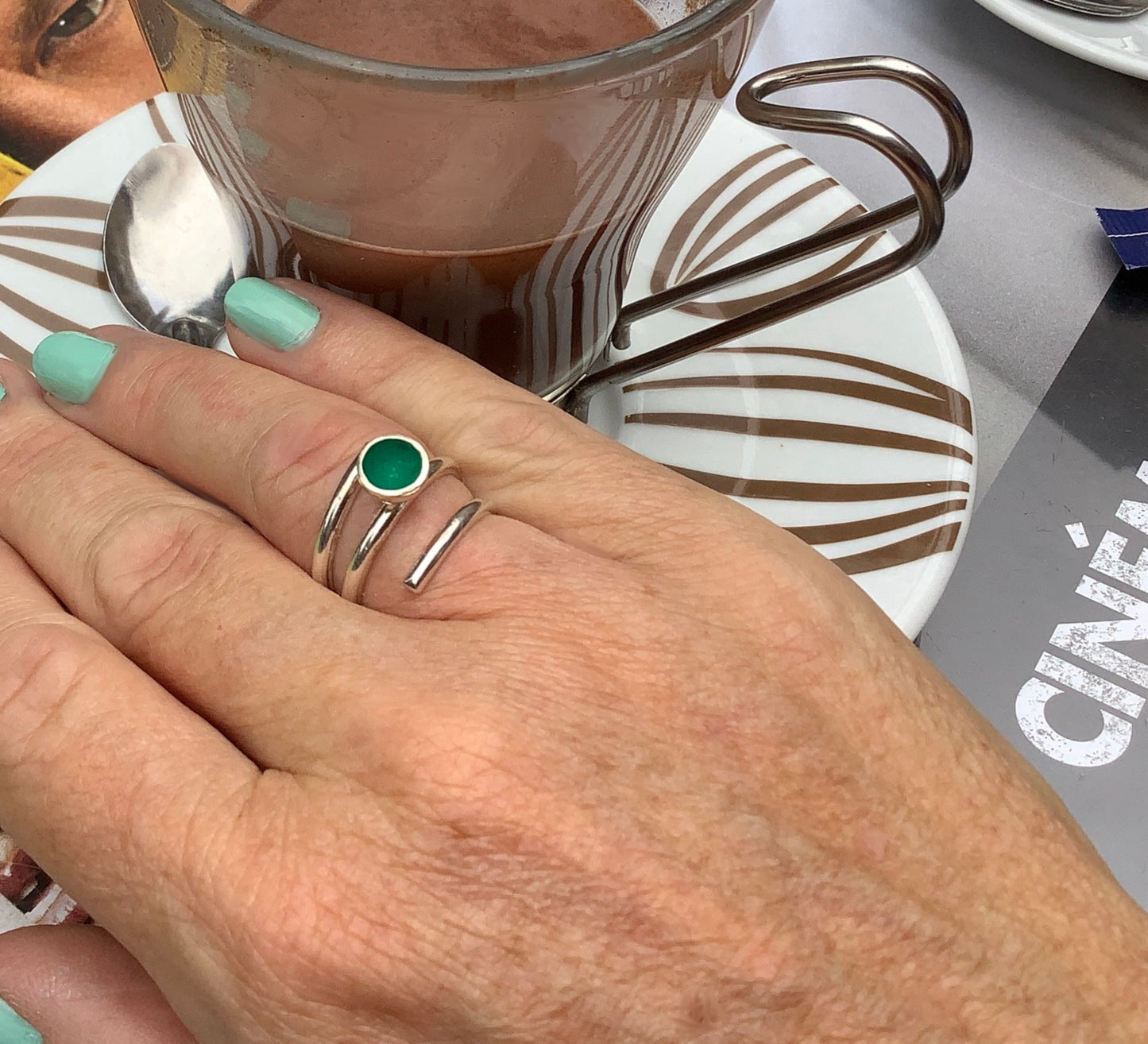 Sterling silver adjustable ring with dark green enamel