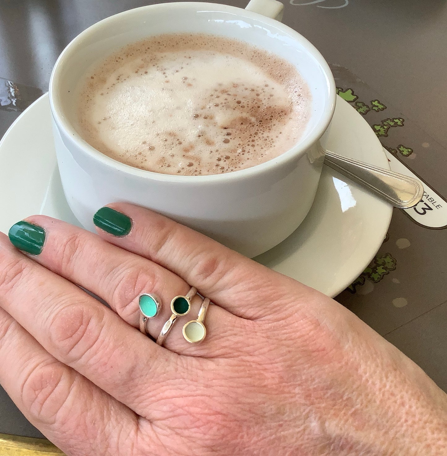 Sterling silver ring with minty green, dark emerald green and white enamel