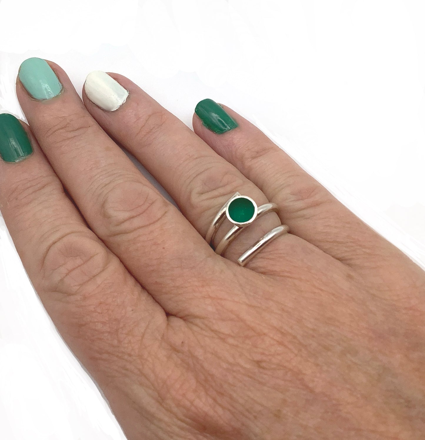 Sterling silver adjustable ring with dark green enamel